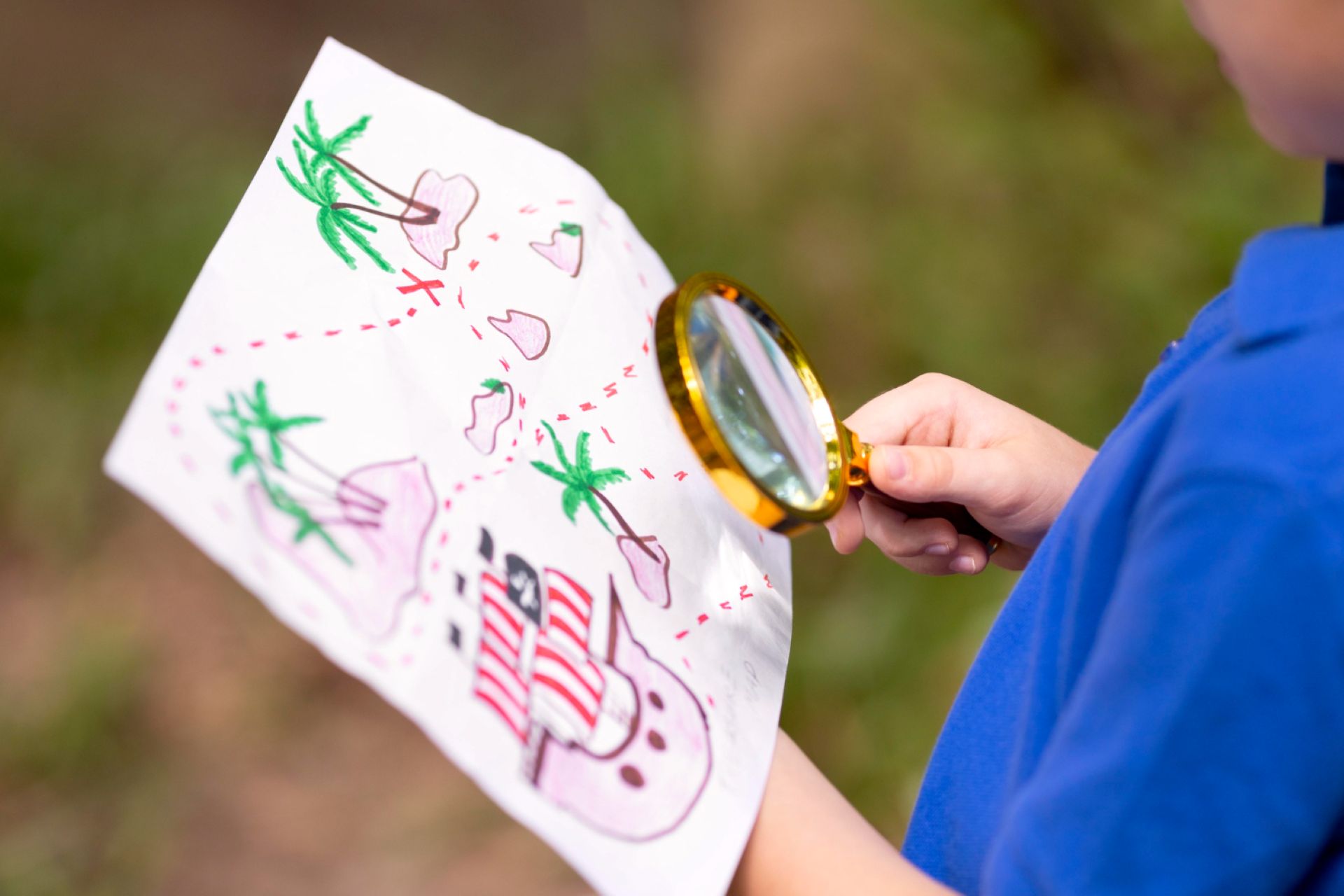 A child looking up a treasure map.