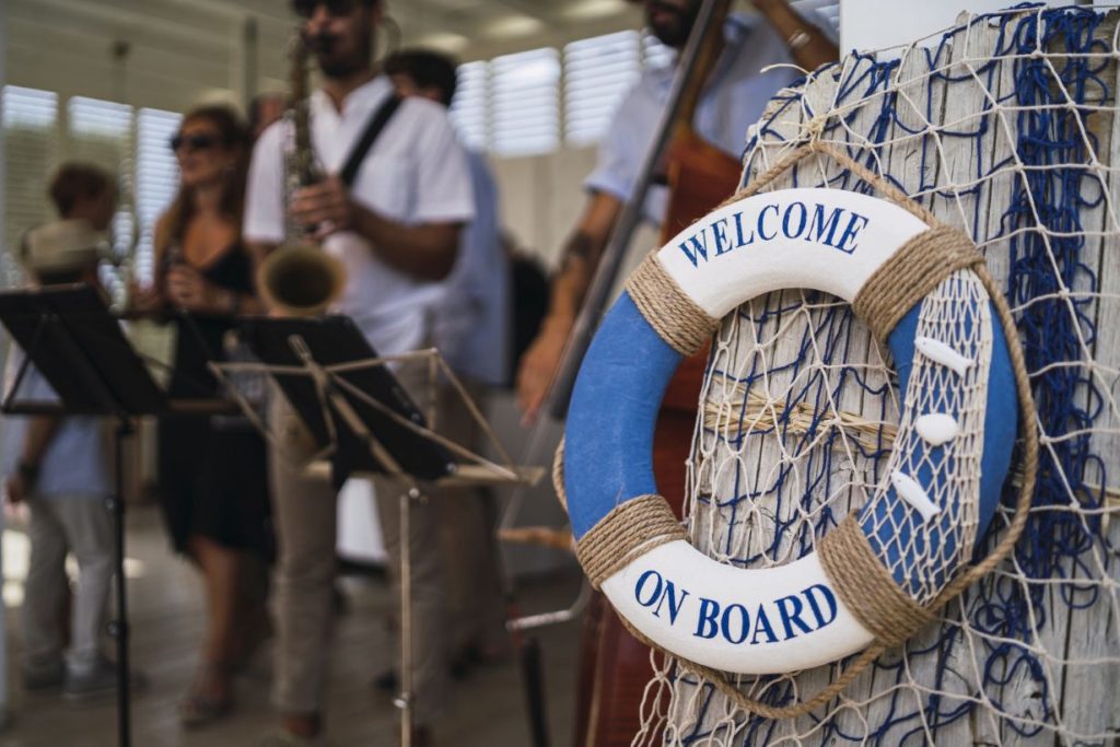 A band playing for the guests on a boat.