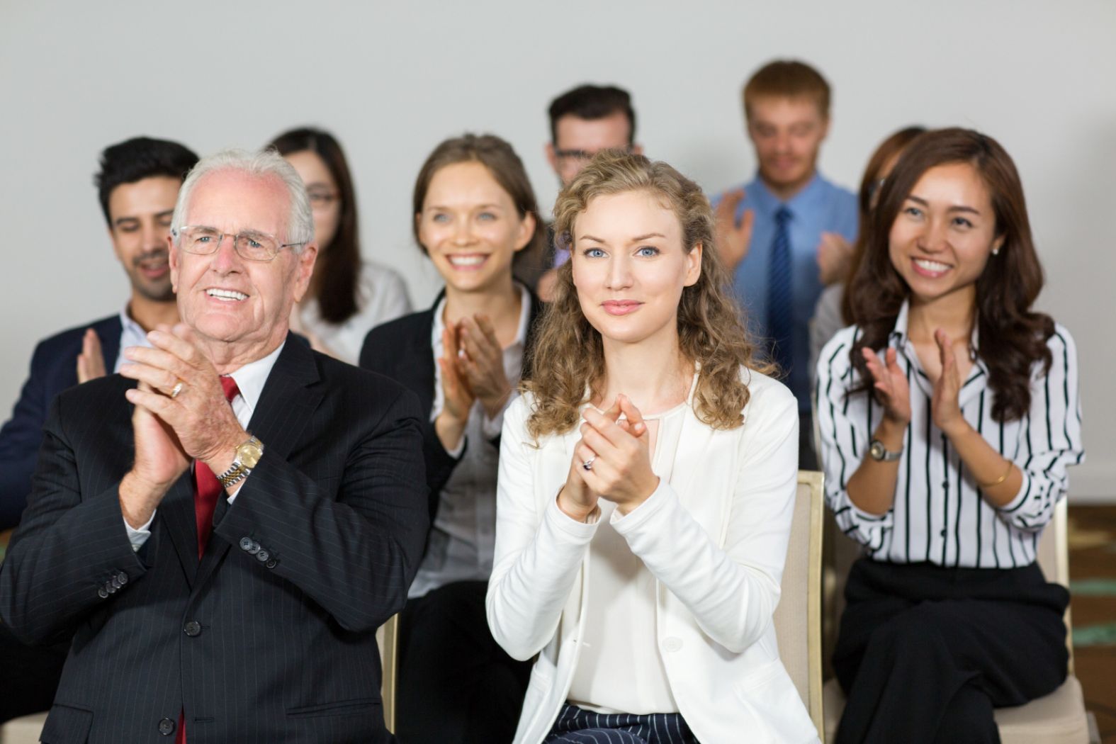 Leaders clapping to each other.